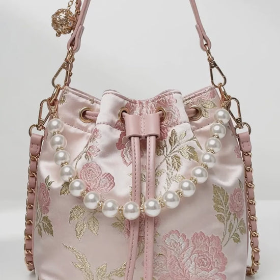 Pink floral bucket bag from the Oddly Cute Luxury Mystery Box, shown from different angles