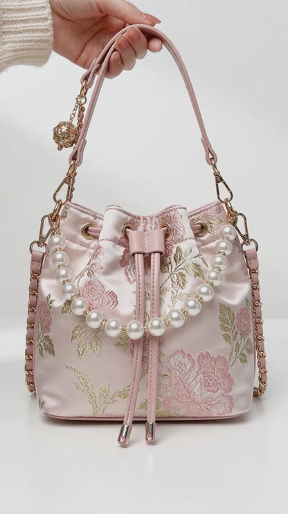 Pink floral bucket bag from the Oddly Cute Luxury Mystery Box, shown from different angles